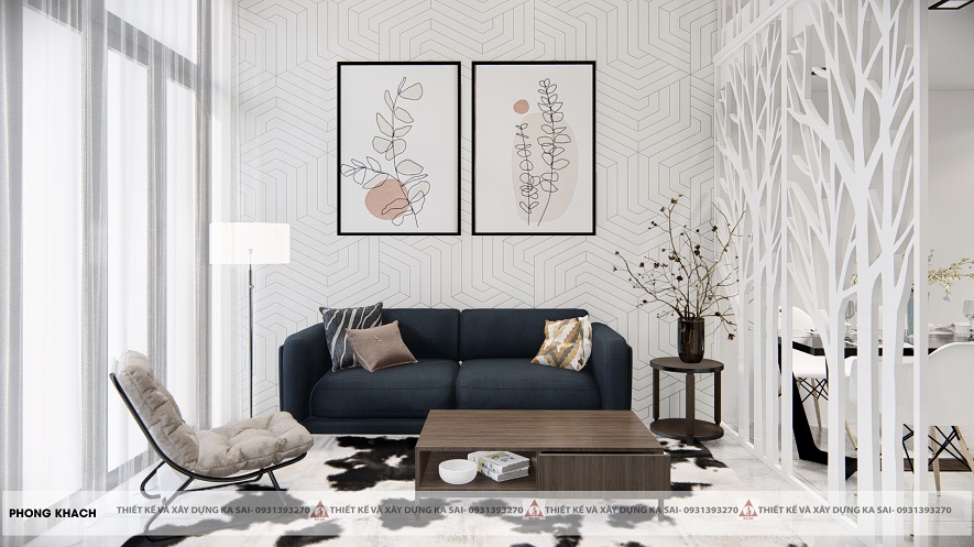 Thiết kế phòng khách với tone màu trắng sáng làm chủ đạo, thêm điểm nhấn bởi chiếc ghế sofa tối màu